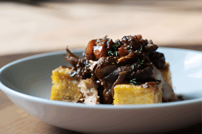 Dijon & Wine Braised Chicken over Polenta Cakes