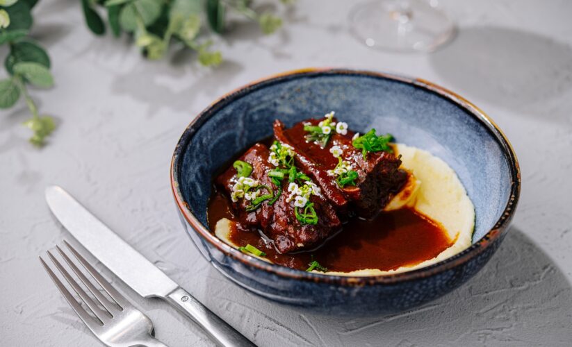 Dijon & Wine Braised Chicken over Polenta Cakes