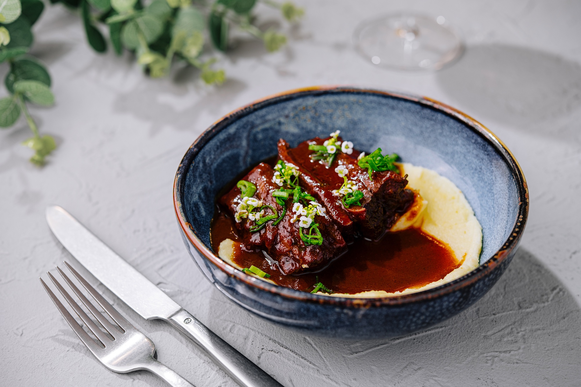 Succulent braised beef ribs with creamy polenta